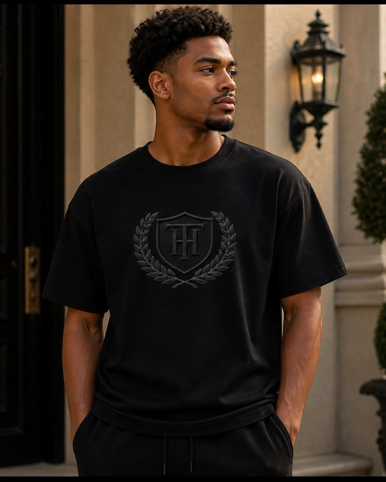 Pray Through It™ Heritage Crest Tee – Noir Laurel Edition